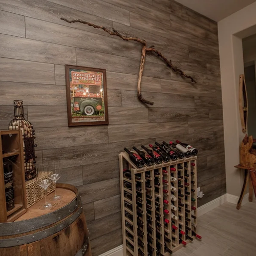 Rustic designed dining area with wine rack and vinyl feature wall | Nielson Fine Floors | Lincoln, CA