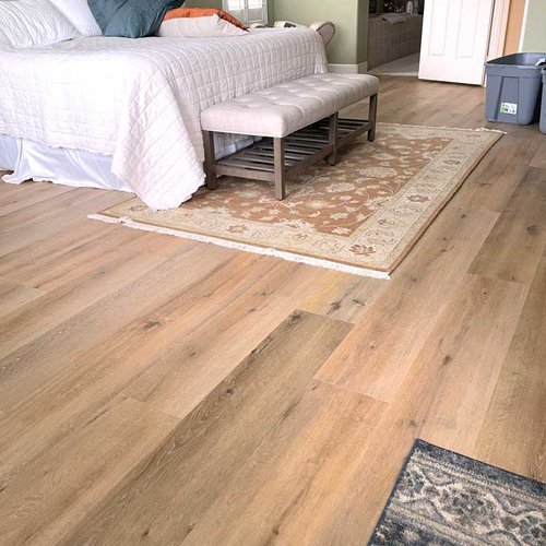 Bedroom with light rustic LVP Flooring